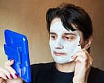 Beautiful Woman Takes Beauty Mask Stock Photo