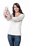 Beautiful Woman Taking Photograph From Phone Stock Photo