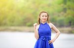 Beautiful Woman Wear Blue Evening Dress Over Mountains And River Stock Photo