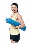 Beautiful Woman With A Yoga Mat Stock Photo