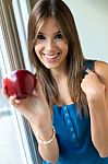 Beautiful Woman With Red Apple At Home Stock Photo