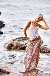 Beautiful Young Blonde Woman Posing Outdoor At The Rocky Sea Sho Stock Photo