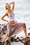 Beautiful Young Blonde Woman Posing Outdoor At The Rocky Sea Sho Stock Photo