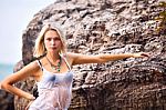 Beautiful Young Blonde Woman Posing Outdoor At The Rocky Sea Sho Stock Photo