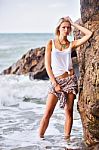 Beautiful Young Blonde Woman Posing Outdoor At The Rocky Sea Sho Stock Photo