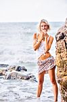 Beautiful Young Blonde Woman Posing Outdoor At The Rocky Sea Sho Stock Photo