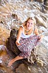 Beautiful Young Blonde Woman Posing Outdoor At The Rocky Sea Sho Stock Photo