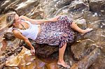 Beautiful Young Blonde Woman Posing Outdoor At The Rocky Sea Sho Stock Photo