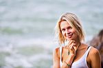 Beautiful Young Blonde Woman Posing Outdoor At The Rocky Sea Sho Stock Photo