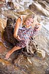 Beautiful Young Blonde Woman Posing Outdoor At The Rocky Sea Sho Stock Photo