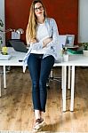 Beautiful Young Businesswoman Looking At Camera In The Office Stock Photo