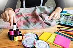 Beautiful Young Fashion Designer Woman Choosing Thread For Sewin Stock Photo