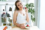 Beautiful Young Woman Enjoying Breakfast At Home Stock Photo