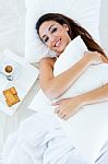 Beautiful Young Woman Having Breakfast On Bed Stock Photo