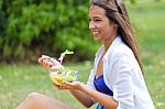 Beautiful Young Woman Holding Green Salad, Outdoors Stock Photo