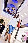 Beautiful Young Woman Holding Shopping Bags Stock Photo