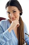 Beautiful Young Woman Looking At Camera At Home Stock Photo