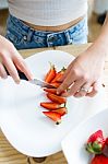 Beautiful Young Woman Preparing Breakfast At Home Stock Photo