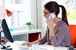 Beautiful Young Woman Using Her Laptop In The Office Stock Photo