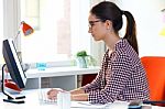 Beautiful Young Woman Using Her Laptop In The Office Stock Photo