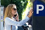 Beautiful Young Woman Using Her Mobile Phone In The Street Stock Photo