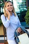 Beautiful Young Woman Using Her Mobile Phone In The Street Stock Photo