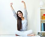 Beautiful Young Woman Waking Up And Stretching Arms At Home Stock Photo