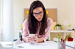 Beautiful Young Woman Working In Her Office Stock Photo