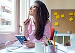 Beautiful Young Woman Working In Her Office Stock Photo