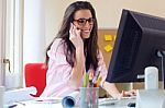 Beautiful Young Woman Working In Her Office Stock Photo