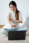 Beautiful Young Woman Working On Her Laptop At Home Stock Photo