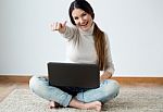 Beautiful Young Woman Working On Her Laptop At Home Stock Photo