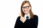 Bespectacled Smiling Student Pointing Away Stock Photo