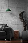 Black Sofa With Wooden Sculpture In Loft Living Room Stock Photo