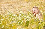 Blond Girl On The Camomile Field Stock Photo