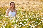 Blond Girl On The Camomile Field Stock Photo