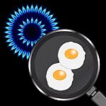 Blue Flame Circle Shape With Frying Pan And Fried Eggs Stock Photo