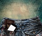 Blue Jeans With Cell Phone, Flashlight And Passport In A Pocket Stock Photo