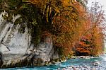 Blue River With Autumn Colors On The Trees Stock Photo