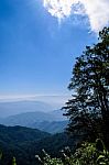 Blue Sky On Mountain Vertical Stock Photo