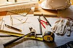 Blueprints, Hardhat, Glasses, Stickers, Construction Level, Pen Stock Photo