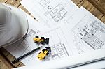 Blueprints, Hardhat Or Safty Helmet, Pen In Architecture Office Stock Photo