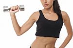 Body Of Slim Female In Activewear Doing Exercise With Dumbbells Stock Photo