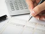 Bookkeeping With Calculator Stock Photo