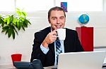 Boss Enjoying Hot Coffee During Work Break Stock Photo