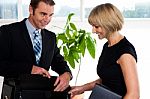 Boss Opening His Briefcase In Front Of Secretary Stock Photo