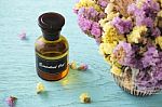 Bottle Of Essential Oil With Flower Stock Photo