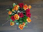 Bouquet Of Roses On Wooden Floor Stock Photo