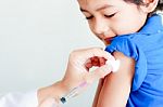 Boy And Vaccine Syringe Stock Photo