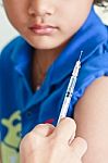 Boy And Vaccine Syringe Stock Photo